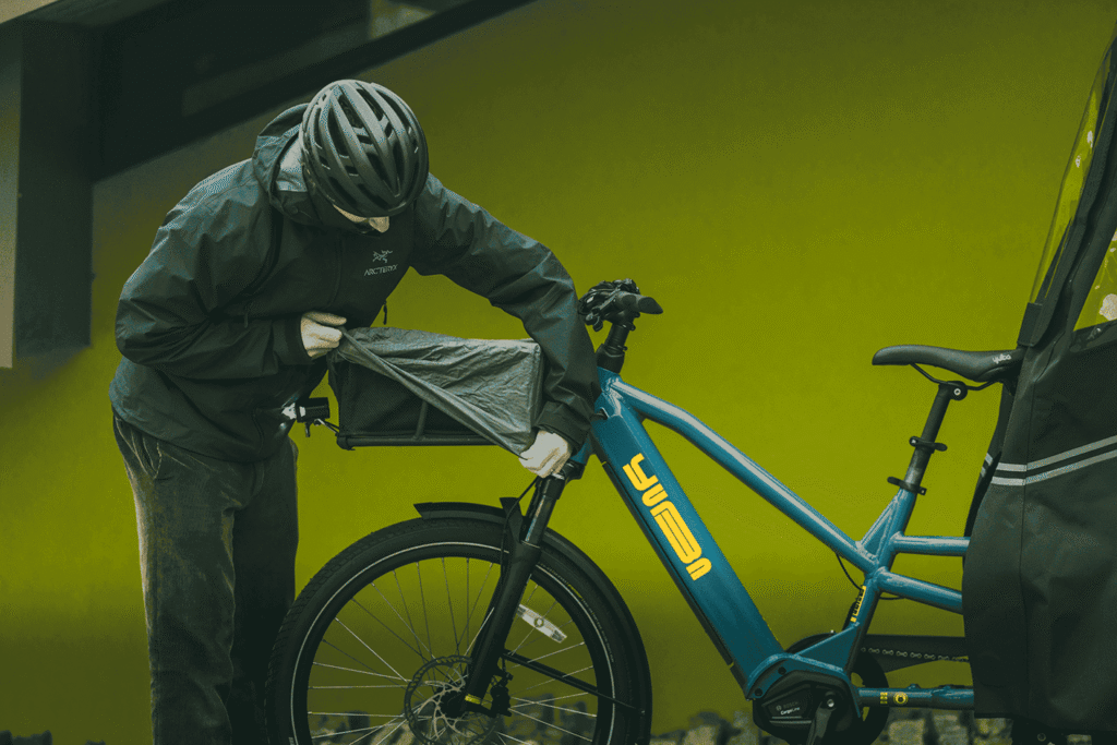 Installing Bread Basket Cover Kit waterproof rain protection on Yuba cargo bike