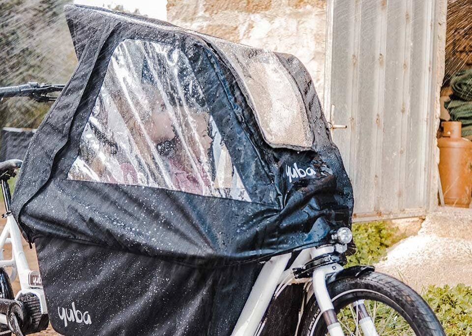 Supercargo Canopy on cargo bike in rain with visible water droplets